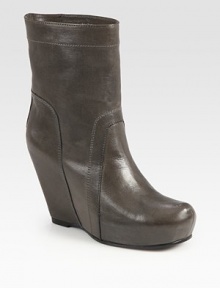 Rich Italian leather with a covered wedge and platform can be paired with a feminine dress or pair of jean shorts. Self-covered wedge, 4 (100mm)Covered platform, 1 (25mm)Compares to a 3 heel (75mm)Leather upperPull-on styleLeather lining and solePadded insoleMade in ItalyOUR FIT MODEL RECOMMENDS ordering one half size up as this style runs small. Rich Italian leather with a covered wedge and platform can be paired with a feminine dress or pair of jean shorts. Self-covered wedge, 4 (100mm)Covered platform, 1 (25mm)Compares to a 3 heel (75mm)Leather upperPull-on styleLeather lining and solePadded insoleMade in ItalyOUR FIT MODEL RECOMMENDS ordering one half size up as this style runs small.