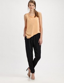 The simple elegance of woven silk, longer in length with a softly draped neckline.Draped necklineSleevelessPullover stylingShirttail hemAbout 29 from shoulder to hemSilkDry cleanImported The simple elegance of woven silk, longer in length with a softly draped neckline.Draped necklineSleevelessPullover stylingShirttail hemAbout 29 from shoulder to hemSilkDry cleanImported
