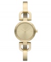 DKNY takes a ladylike turn with this golden bangle watch.
