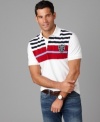 Featuring a crisp color palette and classic stripes, this Tommy Hilfiger polo shirt will be your new weekend go-to.