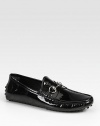 Black patent leather with silver horsebit hardware.Pebbled rubber sole with Gucci logo detailMade in Italy