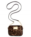 London, Paris, Copacabana, or just car-pooling, this leopard print lovely from MICHAEL Michael Kors is the perfect companion. Soft haircalf is accented with golden hardware and chain-link detailing, while the compact interior easily stows passports and pacifiers.