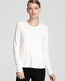 Effortless elegance abounds in everyday looks with this silk Eileen Fisher tee. Layer year round with your favorite accessories. Effortless elegance abounds in everyday looks with this silk Eileen Fisher tee. Layer year round with your favorite accessories.