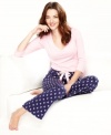 Take a cue from the season of gift giving and tie yourself up in these soft cotton pajamas by Nautica. Plaid  pants feature a satin ribbon drawstring. Comes conveniently wrapped for easy gift-giving.