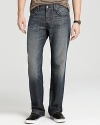 A comfy, everyday relaxed fit jean in a dark wash with distressed edges, light fading and contrast embroidery at pocket.