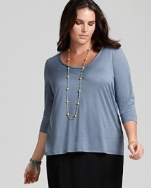 A classic scoop neck flatters the décolleté in this Eileen Fisher basic three-quarter sleeve tee--a must-have for seasonal layering. A classic scoop neck flatters the décolleté in this Eileen Fisher basic three-quarter sleeve tee--a must-have for seasonal layering.