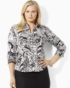 A black-and-white palette is redefined with vibrant florals on the classic Priya shirt, tailored from crisp cotton broadcloth for a feminine take on a menswear staple.