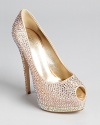 Studded in sparkling Swarovski crystals, these Giuseppe Zanotti peep toe pumps glitter with every move.