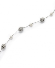 Luxury that lasts. This timeless Eliot Danori bracelet flaunts an exquisite mix of filigree crystal balls and simulated pearls (6 mm). Set in rhodium-plated mixed metal. Approximate length: 7-1/4 inches. Luxury that lasts. This timeless Eliot Danori bracelet flaunts an exquisite mix of filigree crystal balls and simulated pearls (6 mm). Set in rhodium-plated mixed metal. Approximate length: 7-1/4 inches.