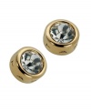 With a bezel setting in gold tone mixed metal and sparkling clear crystals, T Tahari's logo embossed stud earrings epitomize understated elegance. Approximate diameter: 1/2 inch.