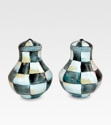 A charming pair that will always have a place at the table, handpainted in a checkerboard juxtaposition of ivory and onyx with bronzed stainless steel trim. Enameled steel Each, 3H X 2½ diam. Hand wash Imported 