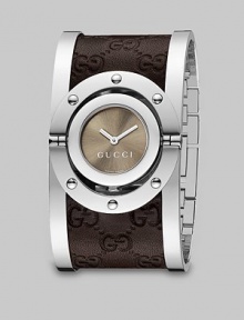 From the Twirl Collection. A modern design featuring a sun-brushed color dial and a stainless steel cuff with brown leather Guccissima inset. Swiss quartz movementWater resistant case to 3 ATMRound stainless steel case, 23mm (0.9)Riveted bezelBrown sun-brushed color dialStainless steel cuff with brown Guccissima leather insetMade in Switzerland From the Twirl Collection. A modern design featuring a sun-brushed color dial and a stainless steel cuff with brown leather Guccissima inset. Swiss quartz movementWater resistant case to 3 ATMRound stainless steel case, 23mm (0.9)Riveted bezelBrown sun-brushed color dialStainless steel cuff with brown Guccissima leather insetMade in Switzerland