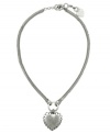 Love conquers all. This flattering heart pendant by Jessica Simpson portrays a unique touch in worn silver tone mixed metal with textured edges. Approximate length: 18 inches + 1-inch extender. Approximate drop: 1-1/2 inches.
