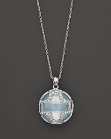 A faceted doublet of Swiss blue topaz and white sapphire, set in sterling silver, forms an elegant Maltese cross. By Elizabeth Showers. A faceted doublet of Swiss blue topaz and white sapphire, set in sterling silver, forms an elegant Maltese cross. By Elizabeth Showers.