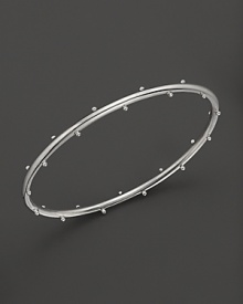 Sterling silver buds blossom on this Elizabeth Showers bangle. Sterling silver buds blossom on this Elizabeth Showers bangle.