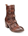 Rustic, distressed leather, put together with buckles up each shaft, gives these VINCE CAMUTO booties a distinctive look.