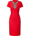 Luxe short sleeve cocktail dress in fine red wool - Eye-catching color and sexy, feminine fit make a bold statement - Hits below the knee - Ruching at sides - Intricate bead embellishment at chest and cut out detail create the illusion of a separate neck piece - Pair with platform pumps and cocktail rings