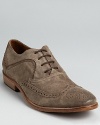 Weathered suede and classic wingtip perforation details complete this beautifully rendered oxford from John Varvatos.