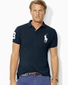 Designed with a trim cut through the body and a shorter hem, this short-sleeved polo shirt is crafted from breathable cotton mesh with Ralph Lauren's Big Pony.