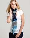 A boho-chic tie dye scarf with baby fringe edges.