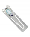 The perfect gift for the ultimate bookworm. This sentimental piece by Vatican features a blue enamel, cameo angel accented by sparkling light blue and Montana crystals. Crafted in silver tone mixed metal. Approximate length: 3 inches.