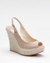 A rich leather style with multiple personalities - part slingback, part espadrille, part sandal - all on a platform wedge.Rope-covered wedge, 5 (125mm) Covered platform, 1¾ (45mm) Compares to a 3¼ heel (80mm) Leather upper Open toe Adjustable buckle slingback Leather lining Padded insole Rubber sole Made in ItalyOUR FIT MODEL RECOMMENDS ordering one half size up as this style runs small. 