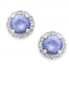 True beauties. These stunning earrings feature round-cut tanzanite (9/10 ct. t.w.) surrounded by halos of round-cut diamonds (1/8 ct. t.w.). Set in sterling silver. Approximate diameter: 7-1/2 mm.