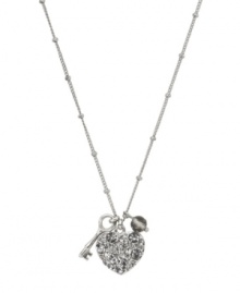 The key to every girl's heart involves a little glamour. Fossil's keepsake pendant features a crystal-coated heart, a small key charm, and a faceted glass bead. Setting, chain and lobster claw clasp crafted in silver tone mixed metal. Approximate length: 16 inches + 2-inch extender. Approximate drop: 3/4 inch. The key to every girl's heart involves a little glamour. Fossil's keepsake pendant features a crystal-coated heart, a small key charm, and a faceted glass bead. Setting, chain and lobster claw clasp crafted in silver tone mixed metal. Approximate length: 16 inches + 2-inch extender. Approximate drop: 3/4 inch.
