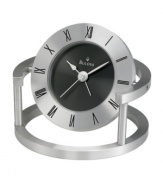 Contemporary flair marks this bedside alarm clock by Bulova. Spun and brushed aluminum frame holds a round pivoting case. Bezel etched with black Roman numerals and black dial features two silver tone hands. Features beep alarm.