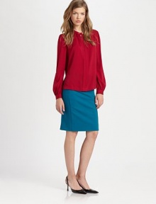 Billowy silhouette and bishop sleeves add '70s flair to this silk-rich staple. Split roundneck with button closuresLong bishop sleevesButtoned cuffs95% silk/5% spandexDry cleanImportedModel shown is 5'9 (175cm) wearing US size 4. Billowy silhouette and bishop sleeves add '70s flair to this silk-rich staple. Split roundneck with button closuresLong bishop sleevesButtoned cuffs95% silk/5% spandexDry cleanImportedModel shown is 5'9 (175cm) wearing US size 4.