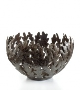Made entirely of recycled steel, the Coral bowl is intricately cut and hammered by Haitian metal artisans to evoke the life-giving sea that laps their shores. Rich texture in its crisscrossed branches add to the special nature of each handmade piece.