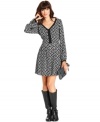 An allover bird print adds an irreverent appeal to this RACHEL Rachel Roy dress for a quirky-cute daytime look!