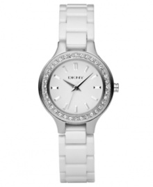 Make every minute brighter with this shining watch by DKNY. White ceramic bracelet and round stainless steel case. Crystal accents at bezel. White dial with logo and silvertone stick indices. Quartz movement. Water resistant to 50 meters. Two-year limited warranty. Make every minute brighter with this shining watch by DKNY. White ceramic bracelet and round stainless steel case. Crystal accents at bezel. White dial with logo and silvertone stick indices. Quartz movement. Water resistant to 50 meters. Two-year limited warranty.
