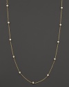 Diamond stations shine on an elegant yellow gold necklace.