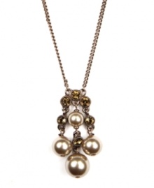 Lustrous mocha glass pearls are complemented by beautiful brown-hued crystals in this striking pendant from Givenchy. Crafted in brown gold tone mixed metal. Approximate length: 16 inches + 2-inch extender. Approximate drop: 1-3/4 inches. Lustrous mocha glass pearls are complemented by beautiful brown-hued crystals in this striking pendant from Givenchy. Crafted in brown gold tone mixed metal. Approximate length: 16 inches + 2-inch extender. Approximate drop: 1-3/4 inches.