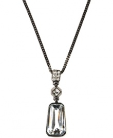 Dazzlingly dramatic. Glittering glass accents and crystals make a stunning statement on this pendant necklace from Givenchy. Crafted in hematite tone mixed metal, it adds sophisticated style to your evening ensemble. Approximate length: 16 inches + 2-inch extender. Approximate drop: 1-1/4 inches. Dazzlingly dramatic. Glittering glass accents and crystals make a stunning statement on this pendant necklace from Givenchy. Crafted in hematite tone mixed metal, it adds sophisticated style to your evening ensemble. Approximate length: 16 inches + 2-inch extender. Approximate drop: 1-1/4 inches.