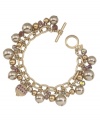 Shift into neutral. A pretty palette of beige and gold makes Carolee's chic charm flex bracelet ideally suited for mixing and matching with your wardrobe. Crafted in gold tone mixed metal, it's embellished with glass accents and imitation pearls. Includes a toggle closure. Approximate length: 7-1/2 inches.