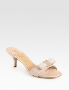 A logo-detailed grosgrain bow lends feminine style to this glossy patent leather slide. Self-covered heel, 2½ (65mm)Patent leather upper with grosgrain ribbon trimLeather lining and solePadded insoleMade in Italy A logo-detailed grosgrain bow lends feminine style to this glossy patent leather slide. Self-covered heel, 2½ (65mm)Patent leather upper with grosgrain ribbon trimLeather lining and solePadded insoleMade in Italy