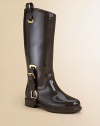With the look of a classic riding boot, this all-rubber, weatherproof style is richly detailed with decorative buckles, stirrup-shaped hardware and pull-on tabs.Pull-on styling with tabsDecorative hardwareRubber upper and solePadded insoleImported