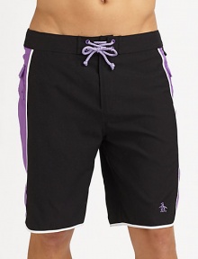Modern, quick-dry trunks for the beach, board and beyond with pieced construction and comfortable knee length. Drawstring waistBack flap pocketsMesh liningInseam, about 9½PolyesterMachine washImported Modern, quick-dry trunks for the beach, board and beyond with pieced construction and comfortable knee length. Drawstring waistBack flap pocketsMesh liningInseam, about 9½PolyesterMachine washImported