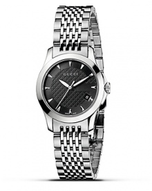 A stainless steel watch from the Gucci G-Timeless collection. Round black dial with pattern and stick hour indices. Sweep second hand and date window. A stainless steel watch from the Gucci G-Timeless collection. Round black dial with pattern and stick hour indices. Sweep second hand and date window.