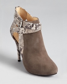 Sumptous suede mingles with snake-embossed accents on the GUESS Conetta booties--buckled up and ready to go in a cool grey hue. Sumptous suede mingles with snake-embossed accents on the GUESS Conetta booties--buckled up and ready to go in a cool grey hue.