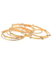 GUESS goes for a minimalist approach with this set of 9 bangle bracelets. Crafted from gold-tone mixed metal, the bangles feature glass stone accents for a stylish complement. Approximate diameter: 2-1/2 inches. GUESS goes for a minimalist approach with this set of 9 bangle bracelets. Crafted from gold-tone mixed metal, the bangles feature glass stone accents for a stylish complement. Approximate diameter: 2-1/2 inches.