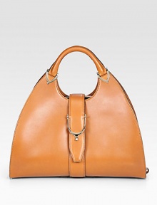 Cuir leather, finished with goldtone hardware, and a stirrup strap closure.Double top handles, 5 drop Stirrup snap and side hook closures Protective metal feet Inside zip, snap, cell phone and PDA pockets Linen lining 15½W X 9½H X 6½D Made in Italy Cuir leather, finished with goldtone hardware, and a stirrup strap closure.Double top handles, 5 drop Stirrup snap and side hook closures Protective metal feet Inside zip, snap, cell phone and PDA pockets Linen lining 15½W X 9½H X 6½D Made in Italy