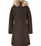 Stylish and sporty with an ultra soft coyote fur trimmed hood, Woolrichs Arctic down parka is a must for cool weather looks - Hood with coyote fur trim, long sleeves, fitted ribbed knit cuffs, hidden two-way front zip, button placket with snaps at hemline, buttoned front flap pockets - Contemporary fit, slight A-line silhouette - A versatile, classic coat perfect for both city streets and country slopes