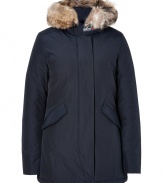 Sporty down-filled in midnight blue coated cotton - Classic by cult-label Woolrich, this parka keeps you warm in sub-zero temperatures - Genuine goose-down - snow-tight coating - Cozy, fur-lined hood - Zipper with additional button catch - Sleeves with air-tight cuffs - Great, butt-covering length - slim and waist-fitted, two lateral pockets - sporty shape - Dream-piece for life, once worn in winter you`ll never part from it again