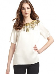 THE LOOKCrew necklineMetallic bugle beads in a geometric pattern, adorn the yokeShort sleevesTHE FITAbout 24 from shoulder to hemTHE MATERIALSilkCARE & ORIGINDry cleanImported THE LOOKCrew necklineMetallic bugle beads in a geometric pattern, adorn the yokeShort sleevesTHE FITAbout 24 from shoulder to hemTHE MATERIALSilkCARE & ORIGINDry cleanImported