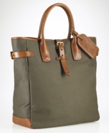 A superior carryall for daily essentials, a polished canvas bag is constructed with saddle-inspired leather trim and comfortable rolled handles and features organizational interior pocketing for quick access to the necessities. A superior carryall for daily essentials, a polished canvas bag is constructed with saddle-inspired leather trim and comfortable rolled handles and features organizational interior pocketing for quick access to the necessities.