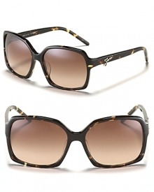 Hit the streets in chic oversized sunglasses with signature metal logo detail along arms from Fendi. Hit the streets in chic oversized sunglasses with signature metal logo detail along arms from Fendi.