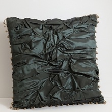 Ruffled pleats jut out all over this eye-catching piece. Accented with contrasting pom-pon trim. Ruffled pleats jut out all over this eye-catching piece. Accented with contrasting pom-pon trim.